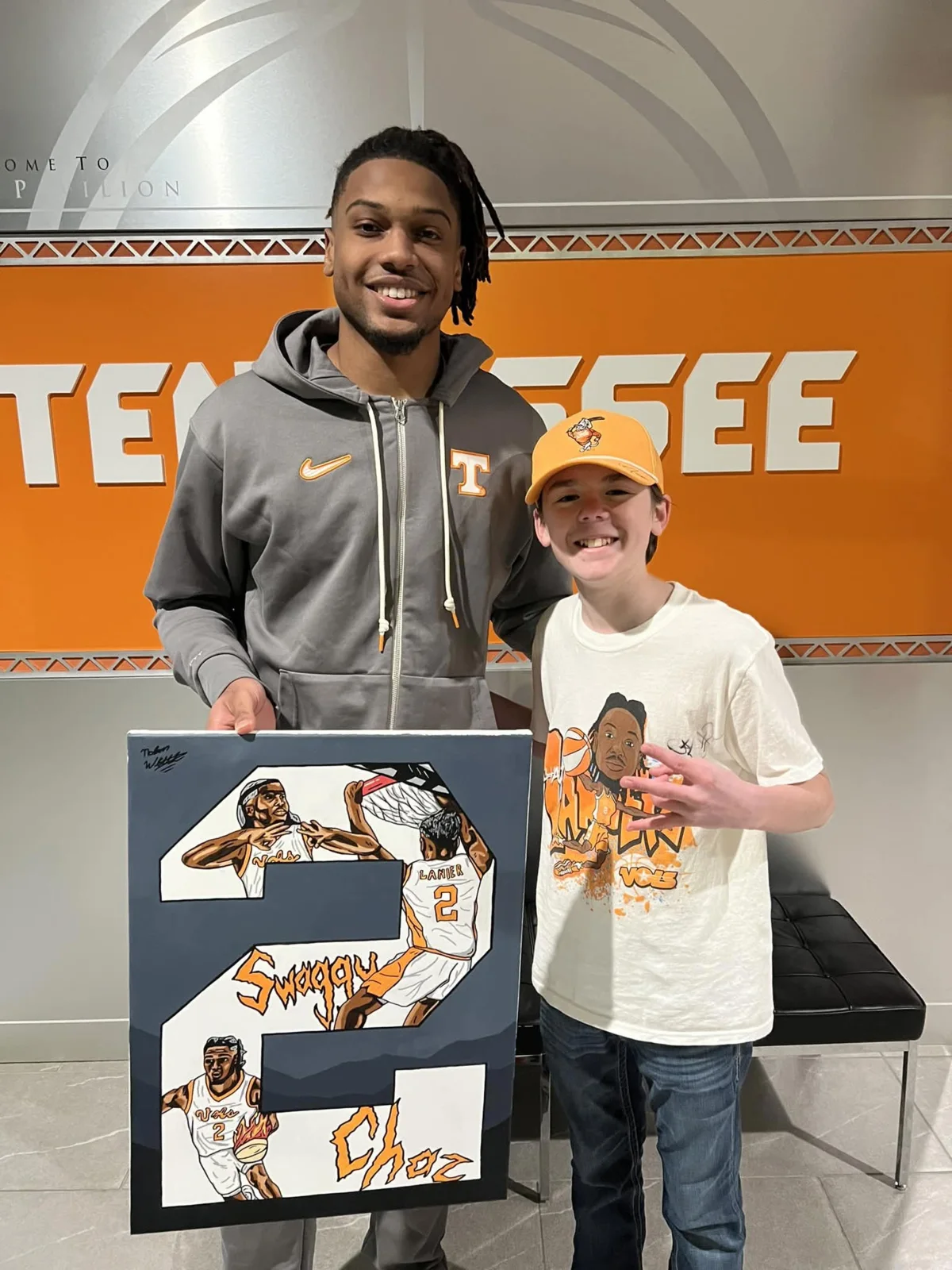 A completed custom sports artwork being presented in person